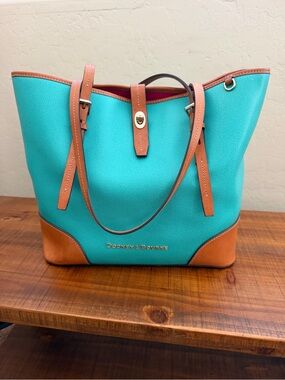 Dooney and Bourke Claremont tote with colorful chevron pattern inside.